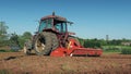 Tractor Passes By Ploughing Field