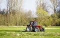 Tractor paves the meadow in spring