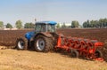 Tractor with plough