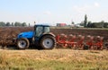 Tractor with plough