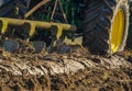 Tractor with plough plow close up