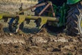 Tractor with plough plow close up