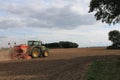 Garforth near Leeds West Yorkshire,UK 18th July 2021 farmer ploughing and seeding a field with tractor and seeding machine