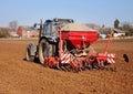 Tractor Ploughing and spreading fertiliser Royalty Free Stock Photo