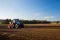 Tractor ploughs field