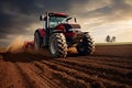 Tractor ploughs field before sowing in spring when it is being prepared for cultivation Royalty Free Stock Photo
