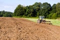 Tractor plowed farm field Royalty Free Stock Photo