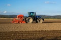 Tractor in plowed field Royalty Free Stock Photo