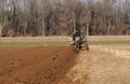 Tractor is plowing the agricultural field in preparation for spring sowing Royalty Free Stock Photo