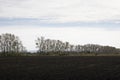 Tractor Plowing Through Agricultural Open Fields