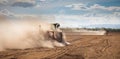 Tractor plowing dry land Royalty Free Stock Photo