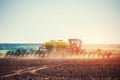 Tractor plowing farm field in preparation for spring planting Royalty Free Stock Photo