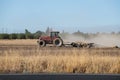 A tractor plowing a field