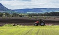 Tractor Plowing Field