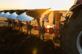 Tractor plowing field the land at sunset Royalty Free Stock Photo