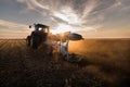 Tractor plowing fields -preparing land for sowings