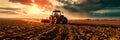 tractor plowing through fields, preparing the soil for spring planting, showcasing the mechanized side of modern