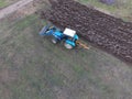 Tractor plowing the garden. Plowing the soil in the garden Royalty Free Stock Photo