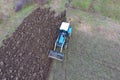 Tractor plowing the garden. Plowing the soil in Royalty Free Stock Photo