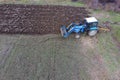 Tractor plowing the garden. Plowing the soil in Royalty Free Stock Photo