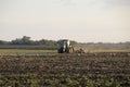 Tractor plowing plow the field. Tilling the soil in the fall after harvest. The end of the season