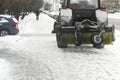 Tractor plowing snow in city