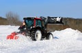 Tractor Plowing Snow on a Yard