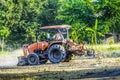 Tractor are plowing to adjust the area for football field and parking. Abstract blur. Royalty Free Stock Photo