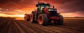 A Tractor Plows The Field During A Captivating Sunset