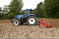 Tractor With Power Harrow Side View Royalty Free Stock Photo