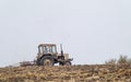 Tractor prepares a field for sowing Royalty Free Stock Photo