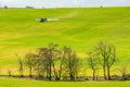 Tractor preparing spring agriculture field and using insecticide which help for the soil