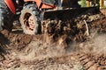 Tractor push clot soil after pour from truck