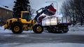 Tractor removes snow form Street tog truck Royalty Free Stock Photo