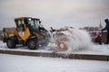 Tractor removes snow from the sidewalk