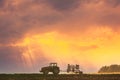 Tractor On Road In Spring Season. Beginning Of Agricultural Spring Season. Cultivator Mounted On Tractor In Countryside Royalty Free Stock Photo