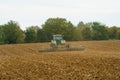 Tractor rollin the ground after sowing seed