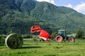 Tractor with round baler Royalty Free Stock Photo