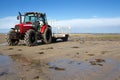 Tractor on a sandy beach Royalty Free Stock Photo