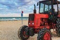 Tractor on the sandy beach Royalty Free Stock Photo