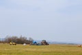 Tractor seeder and bags with seeds in the field. Modern technology in the field. Royalty Free Stock Photo