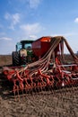 Tractor with seeder in the field in early spring Royalty Free Stock Photo