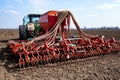 Tractor with seeder in the field in early spring Royalty Free Stock Photo