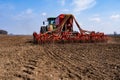 Tractor with seeder in the field in early spring Royalty Free Stock Photo