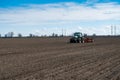 Tractor with seeder in the field in early spring Royalty Free Stock Photo
