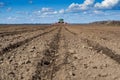 Tractor with seeder in the field in early spring Royalty Free Stock Photo