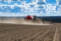 Tractor with seeder in the field in early spring Royalty Free Stock Photo