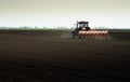 Tractor and seeder for sowing corn