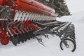 Tractor seeder at winter snow outdoor