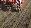 Tractor seeding crops at field. Royalty Free Stock Photo